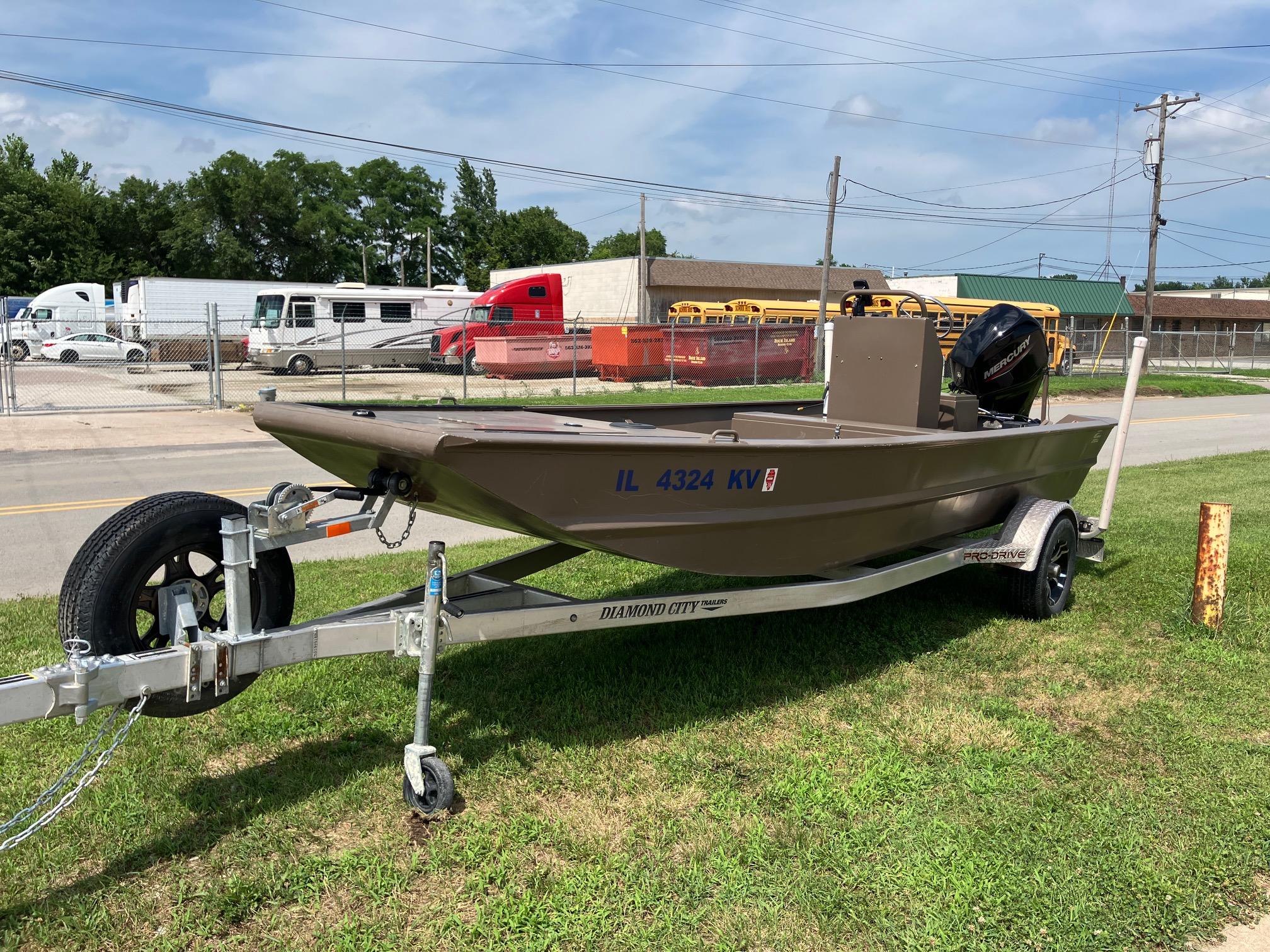 2017 Pro-Drive SBX Series 18' boat on trailer, parked on grass near road.