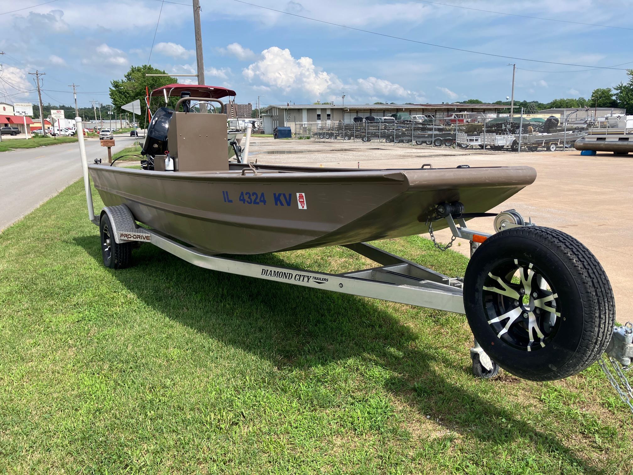 2017 Pro-Drive SBX Series 18' boat on trailer, parked on grass.