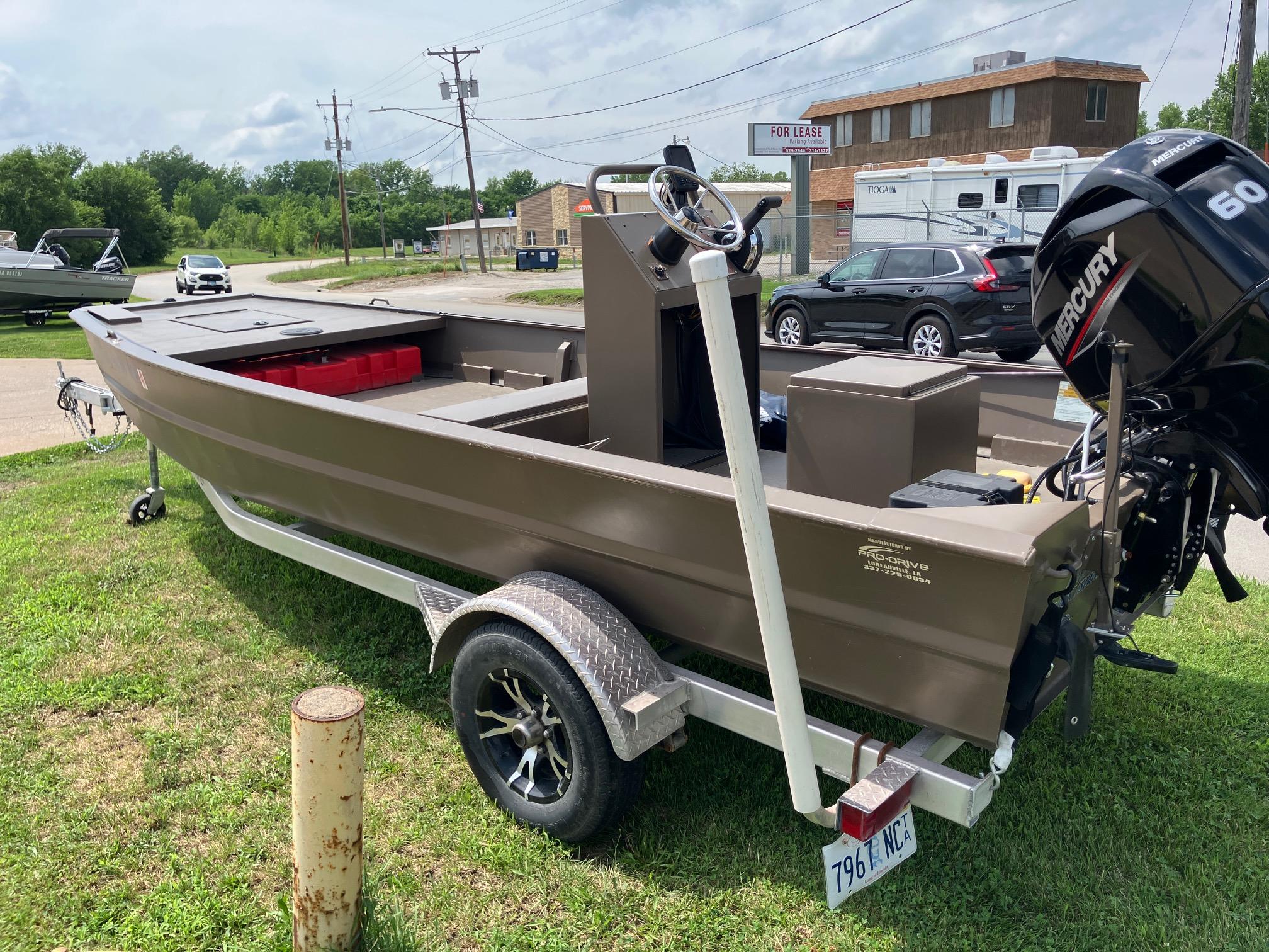 2017 Pro-Drive SBX Series 18' boat with Mercury 60 engine on trailer, parked outdoors.