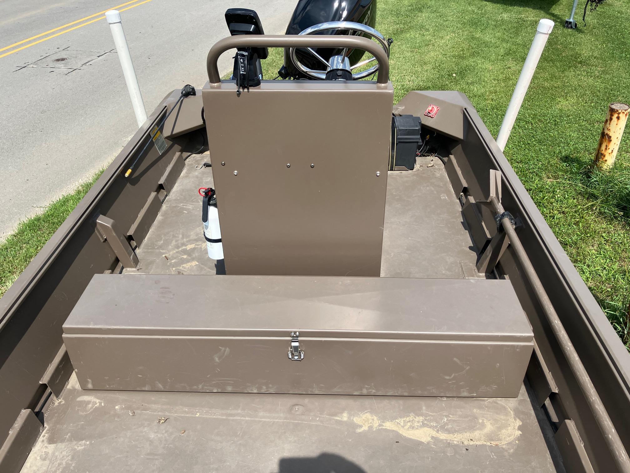 2017 Pro-Drive SBX Series 18' boat interior with storage box and steering console.