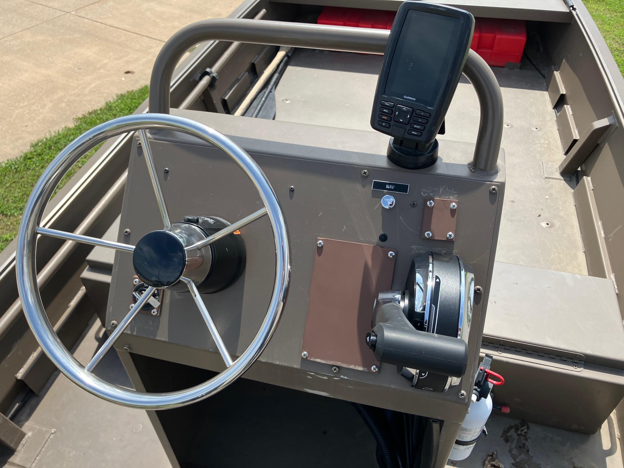 2017 Pro-Drive SBX Series 18' boat console with steering wheel and navigation system.