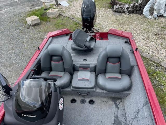 2023 Tracker Pro Team 175 TXW boat interior with gray seating and red accents.