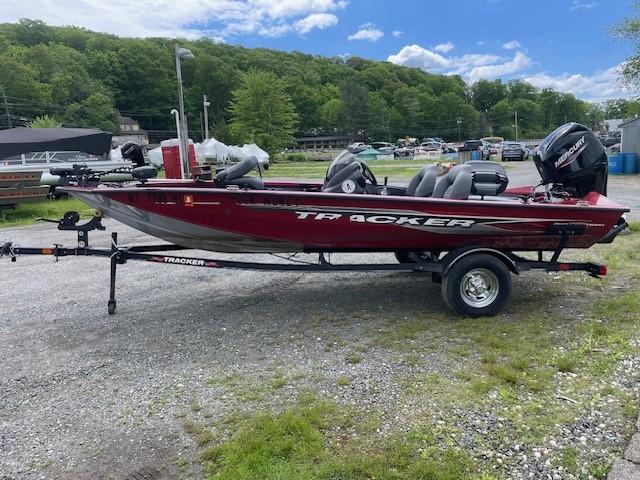 2023 Tracker Pro Team 175 TXW boat on trailer, parked outdoors.