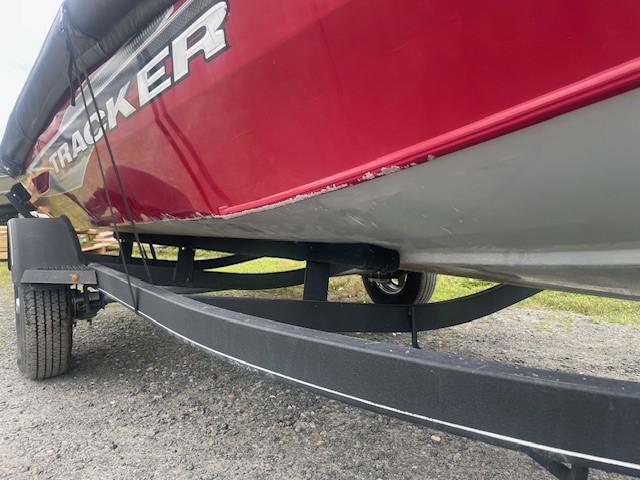 2023 Tracker Pro Team 175 TXW boat on trailer, red and gray exterior.