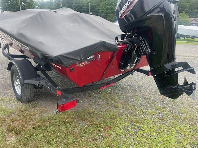 2023 Tracker Pro Team 175 TXW boat with cover and Mercury outboard motor.