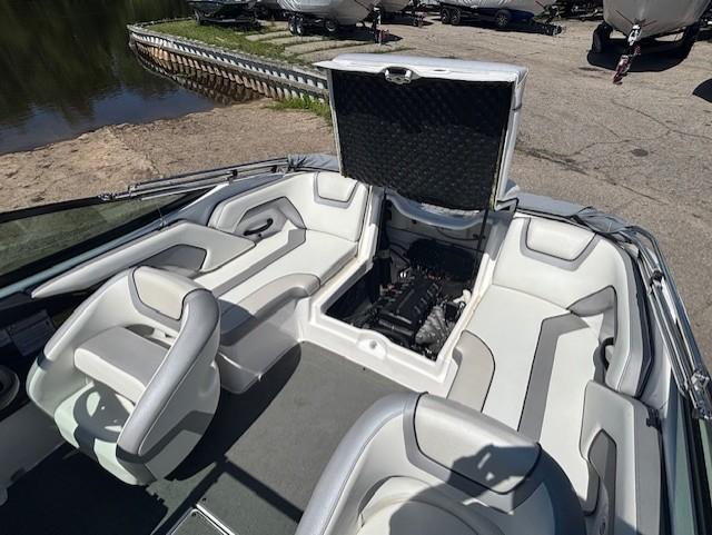 2017 Yamaha Boats SX190 interior with open engine compartment, showcasing seating and design.