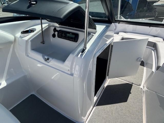 2017 Yamaha SX190 boat interior with open storage compartments and control panel.
