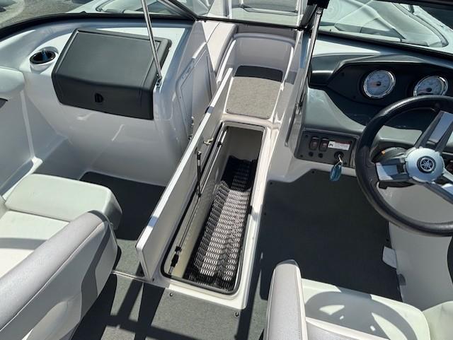 2017 Yamaha Boats SX190 interior with steering wheel, storage compartment, and seating.