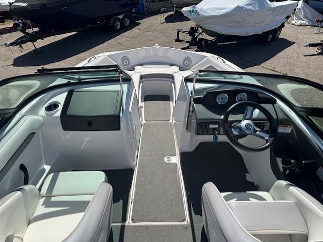 2017 Yamaha Boats SX190 interior with steering wheel and seating, parked outdoors.