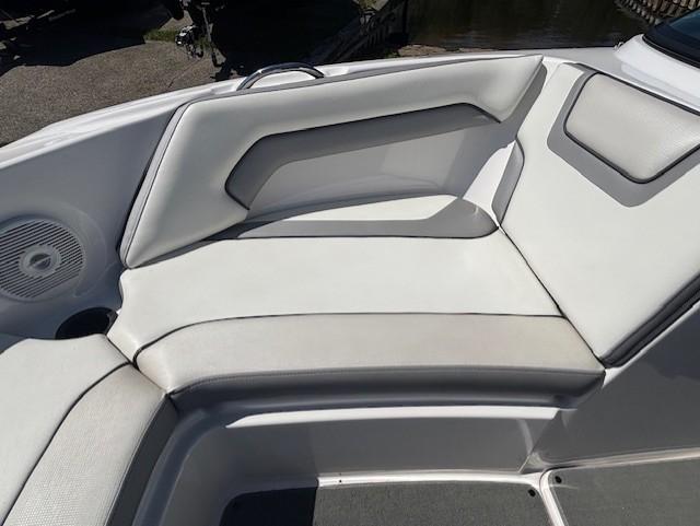 2017 Yamaha Boats SX190 interior seating with white upholstery and speaker.