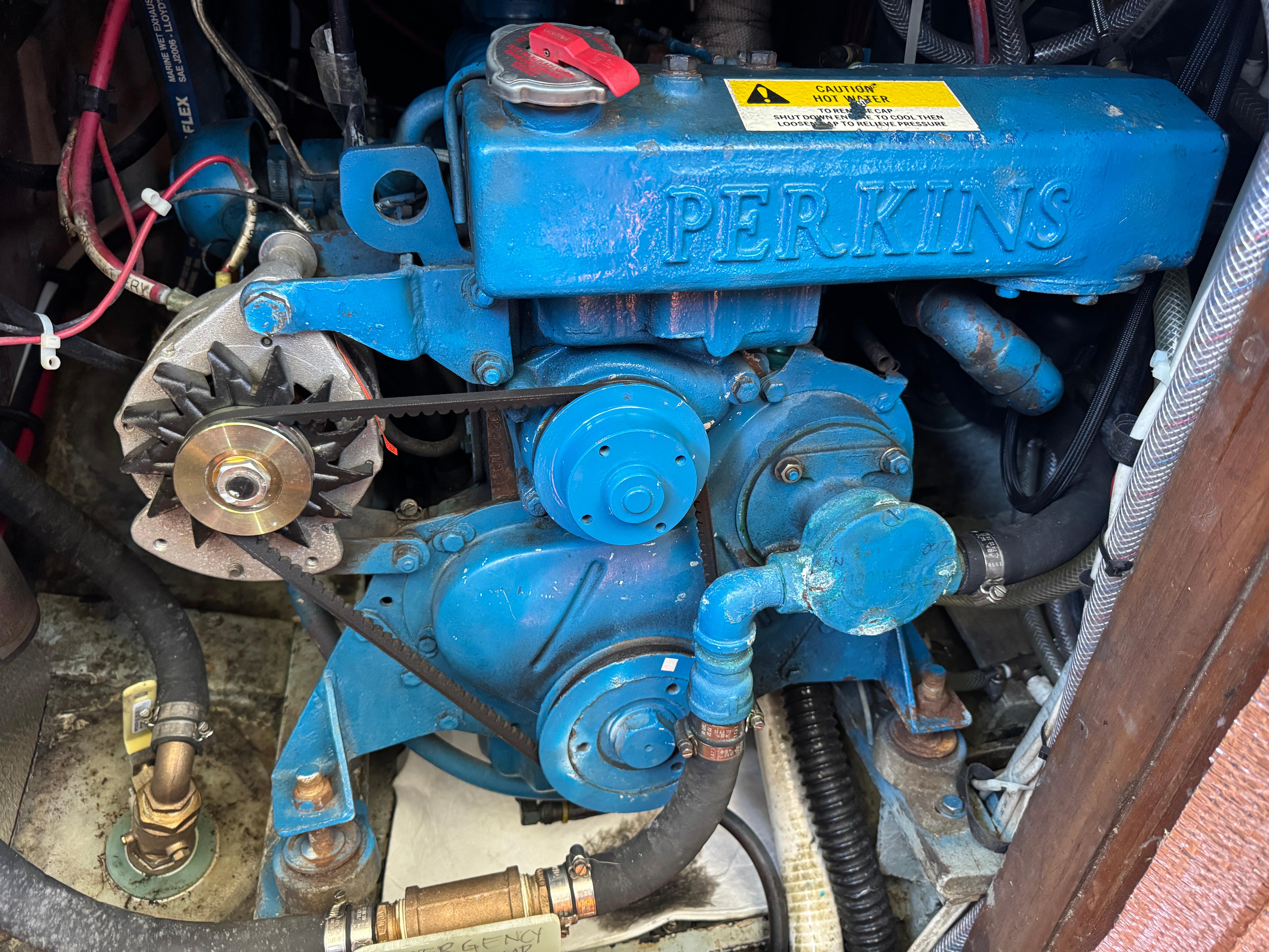 Blue Perkins engine in a 1970 Cheoy Lee Luders 36 sailboat.