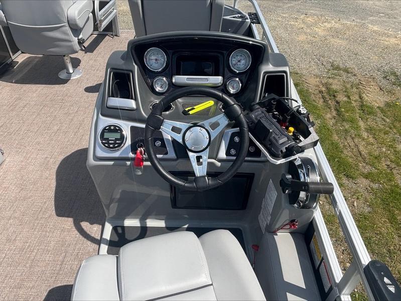 Steering console of 2022 Ranger 220 F boat with gauges and controls.