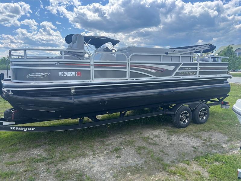 2022 Ranger 220 F pontoon boat on trailer under cloudy sky.