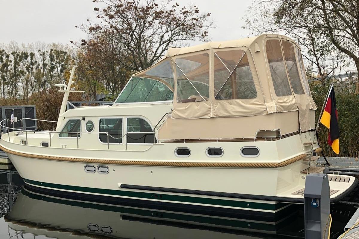 Linssen 36.9 yacht, 2012 model, docked with beige canopy and German flag.