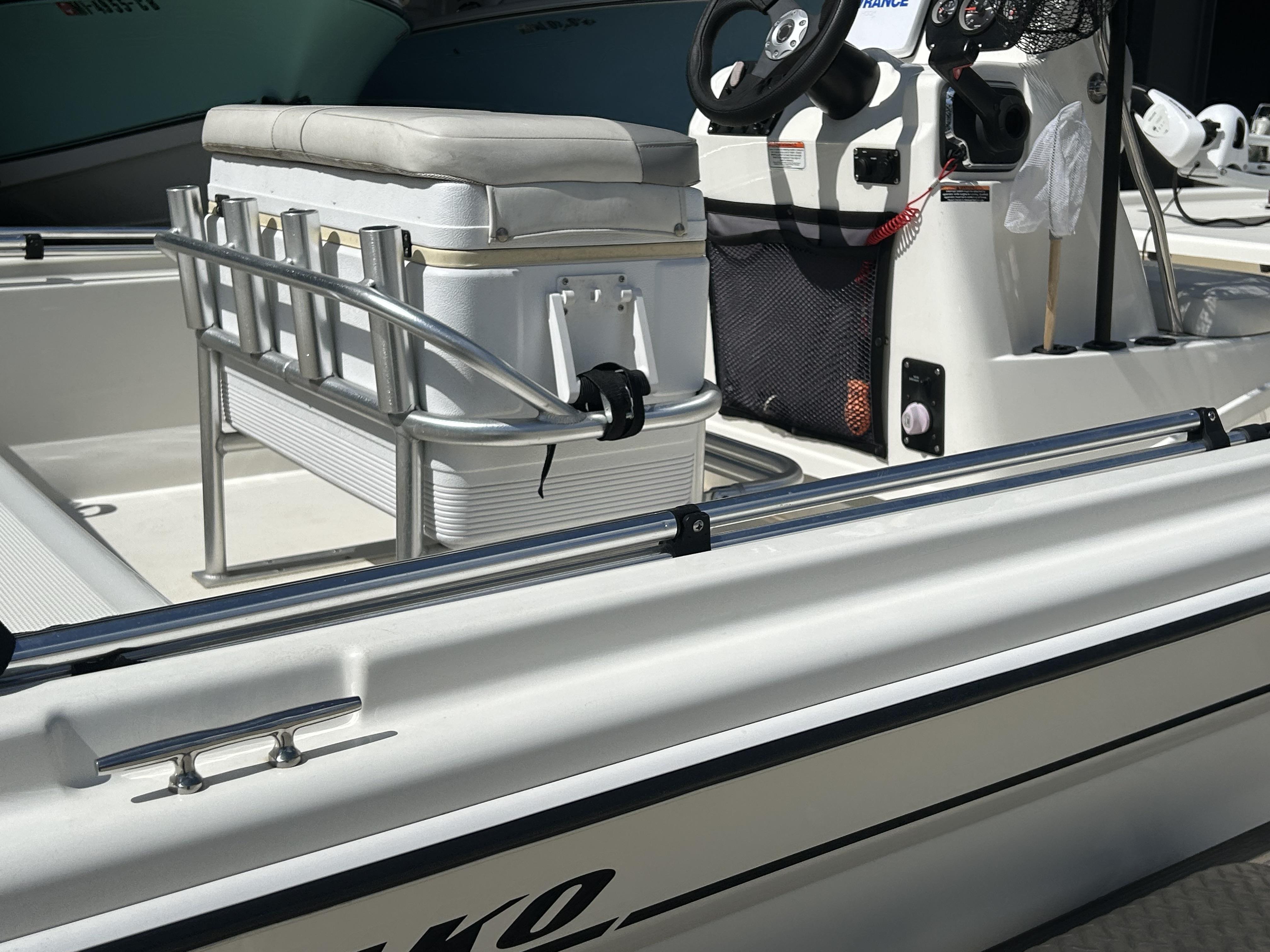 2021 Mako Pro Skiff 19 CC boat interior with steering console and seating.