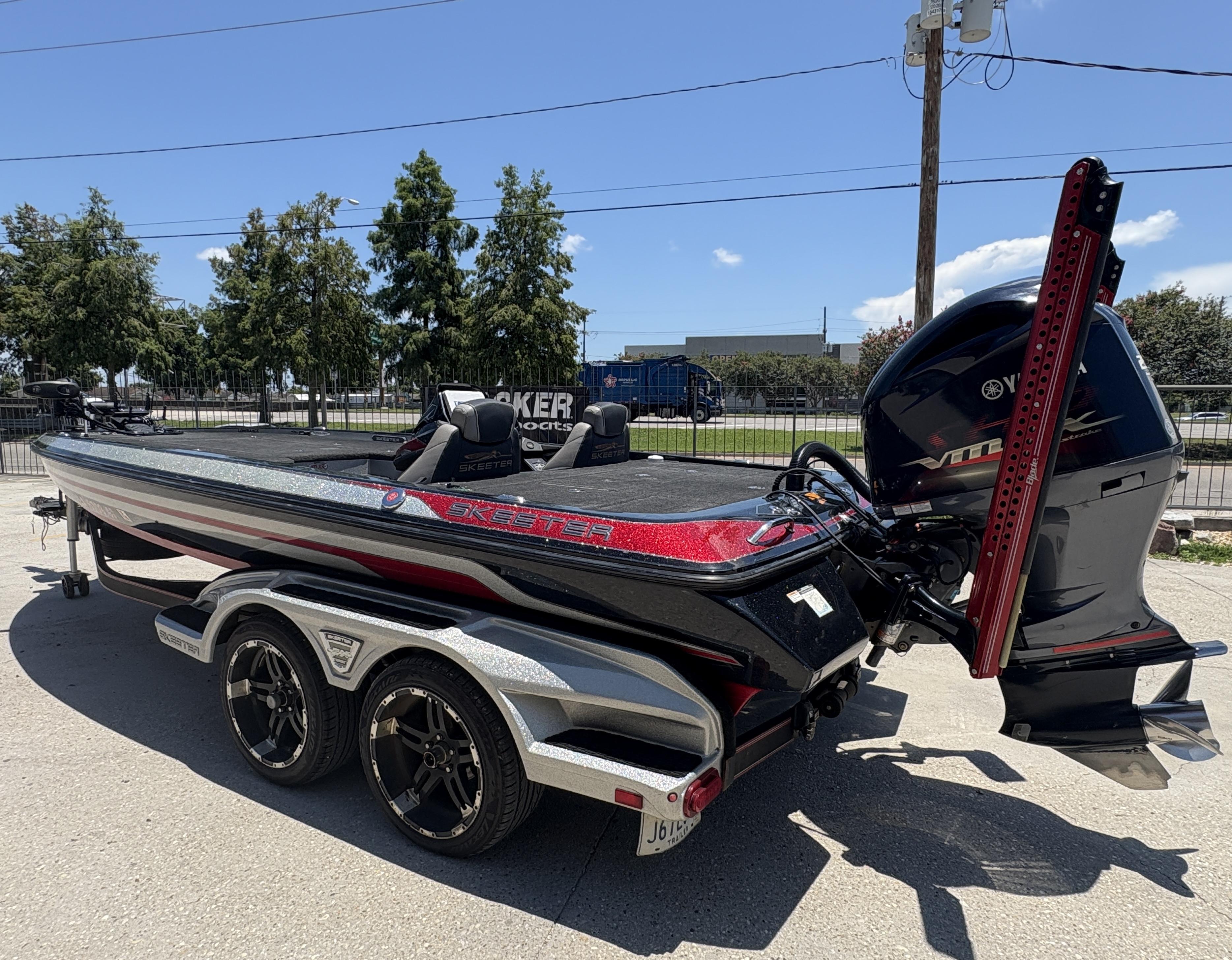 2018 Skeeter FX 21 bass boat with Yamaha engine on a trailer, parked outdoors.