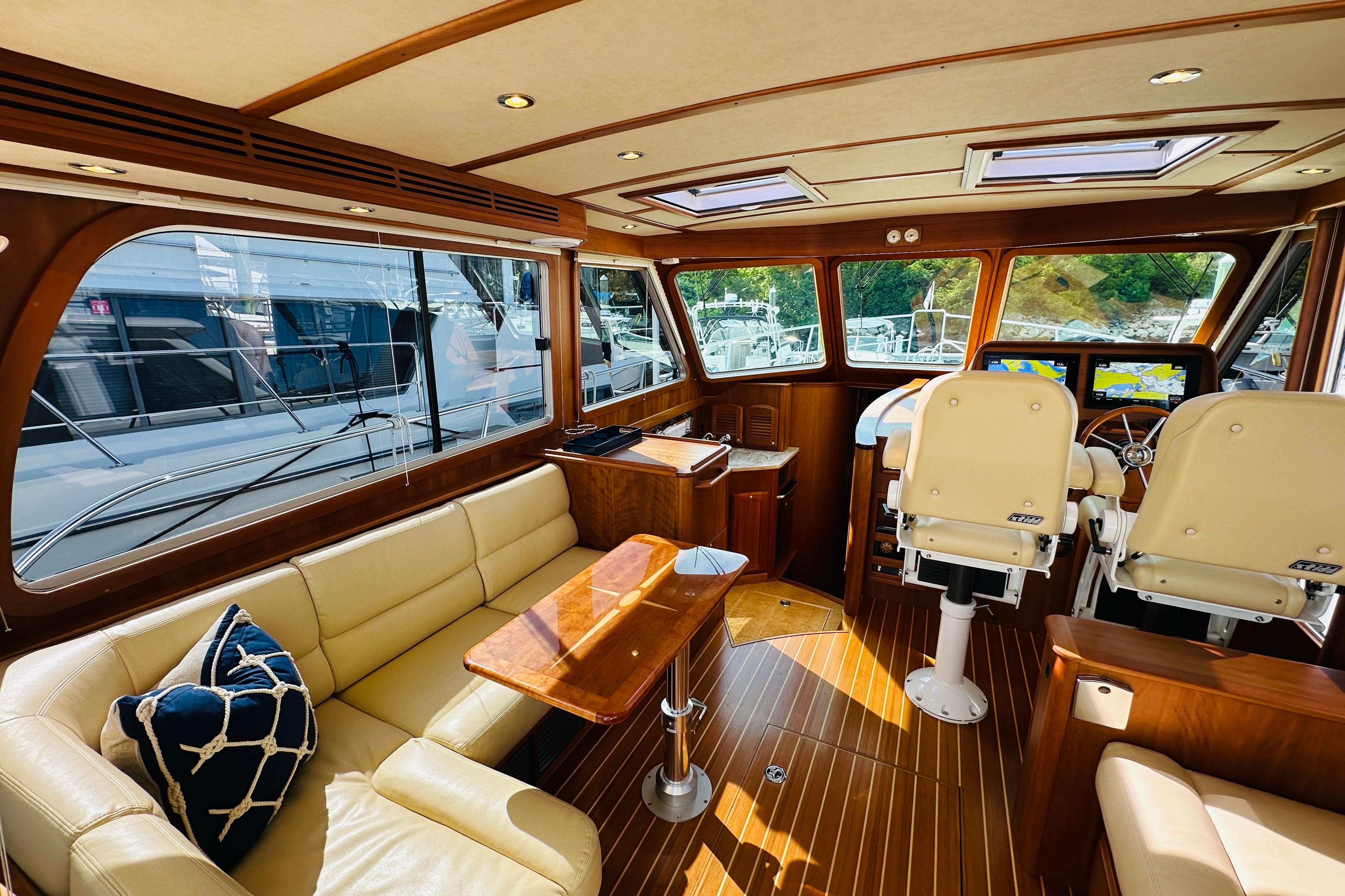 Luxurious interior of 2017 Sabre 42 Salon Express yacht with leather seating and navigation area.