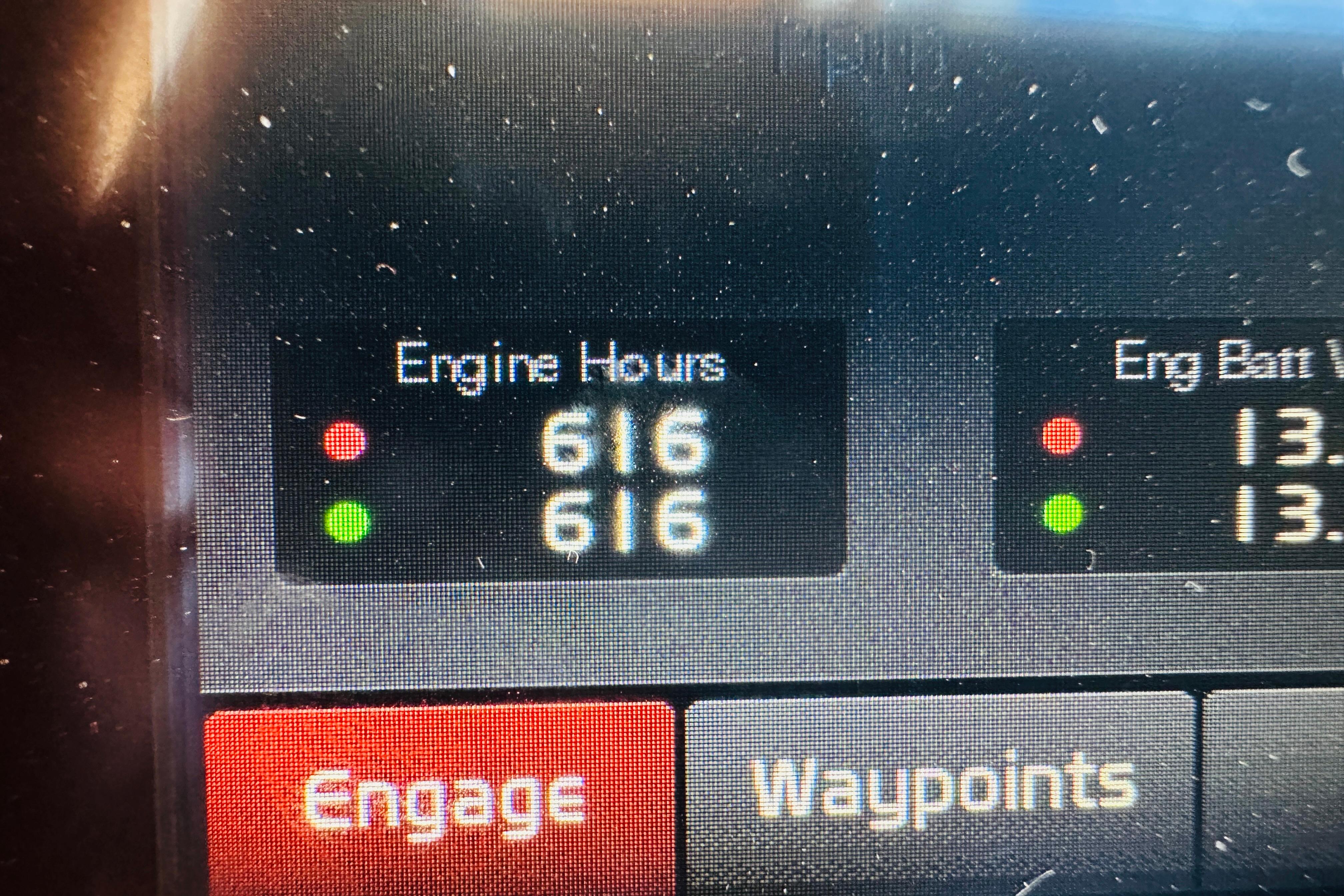Display panel showing engine hours and battery voltage on 2017 Sabre 42 Salon Express.