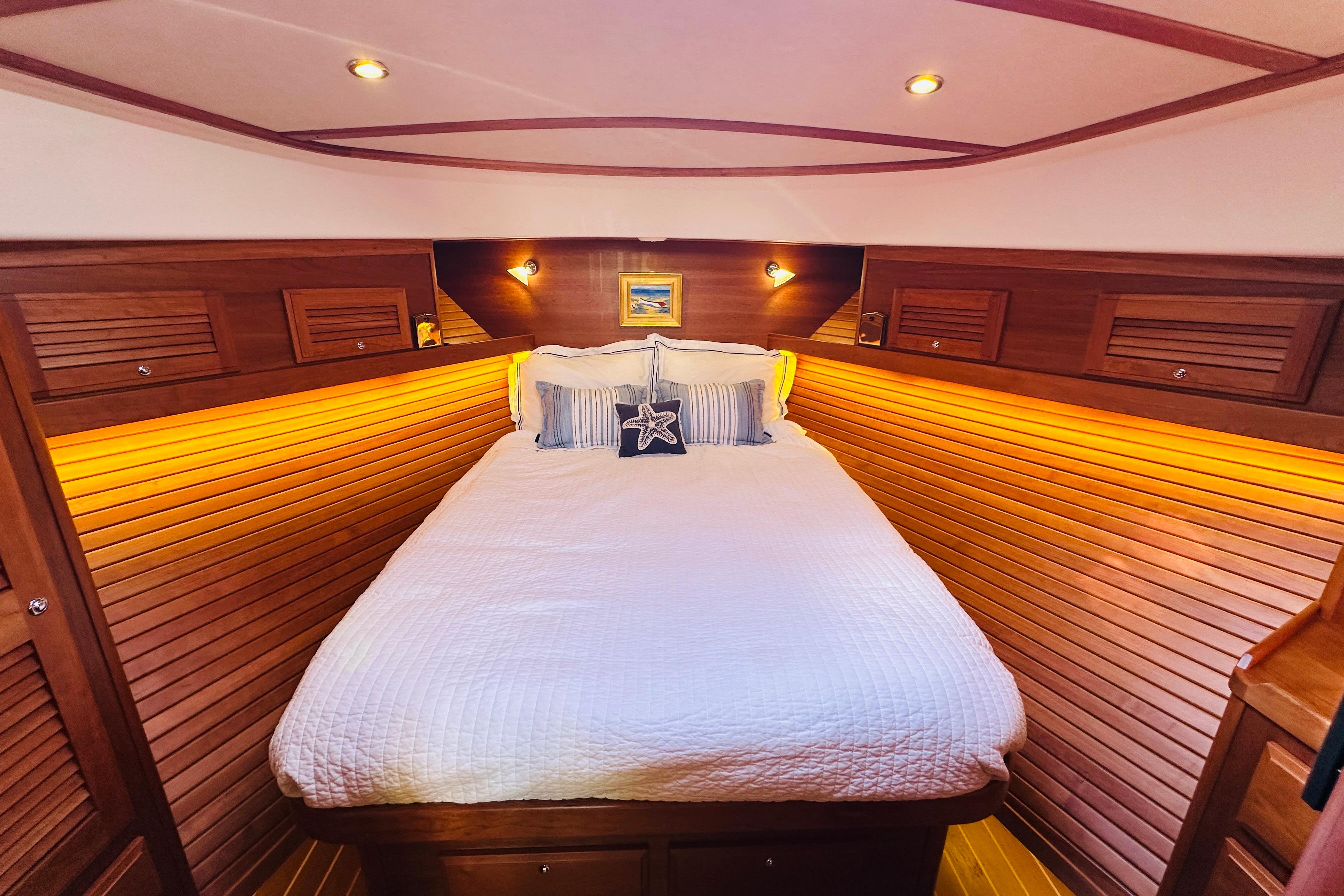 Luxurious cabin interior of 2017 Sabre 42 Salon Express yacht with cozy bedding.
