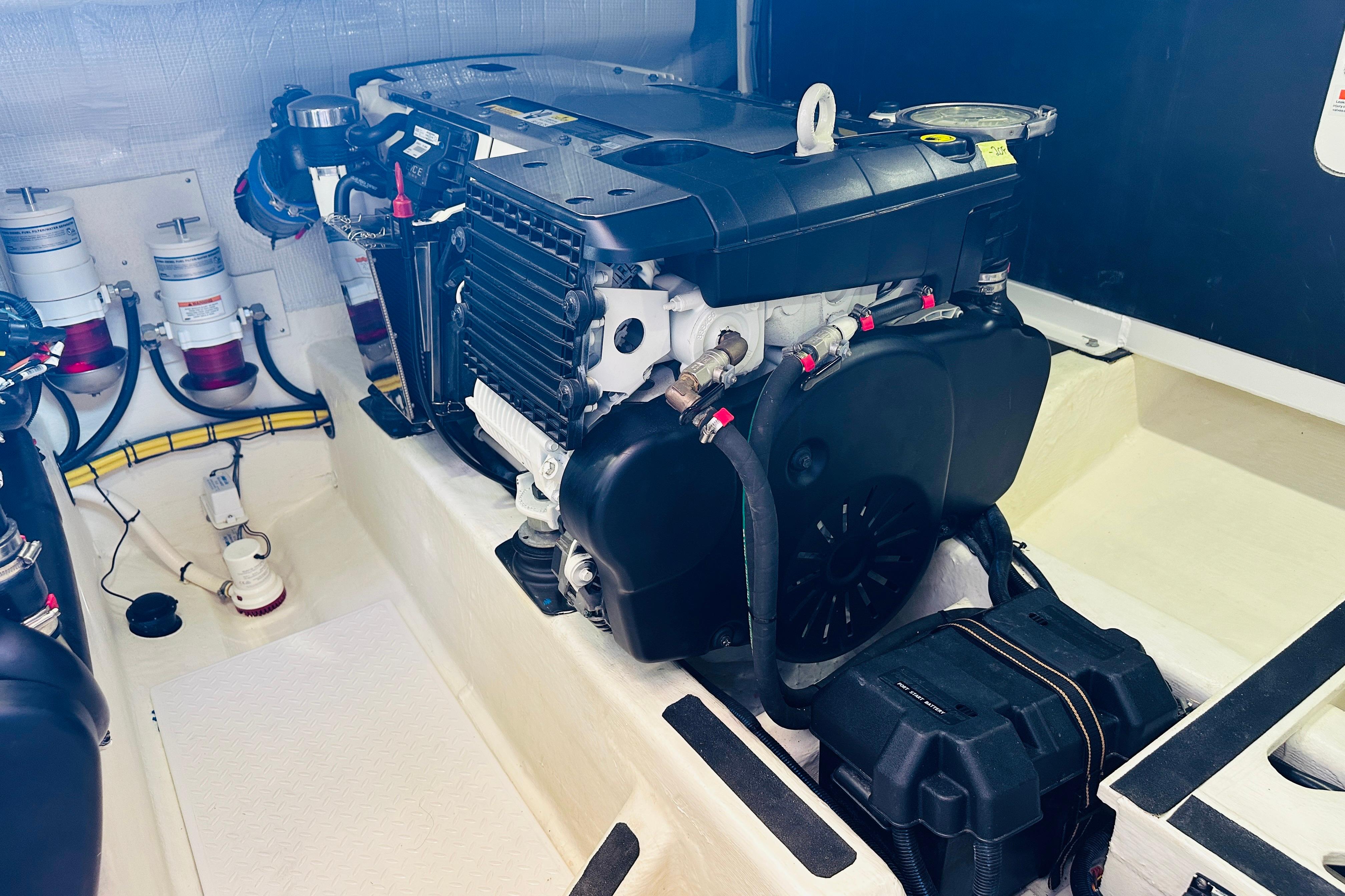 Engine room of 2017 Sabre 42 Salon Express, showcasing detailed mechanical components.