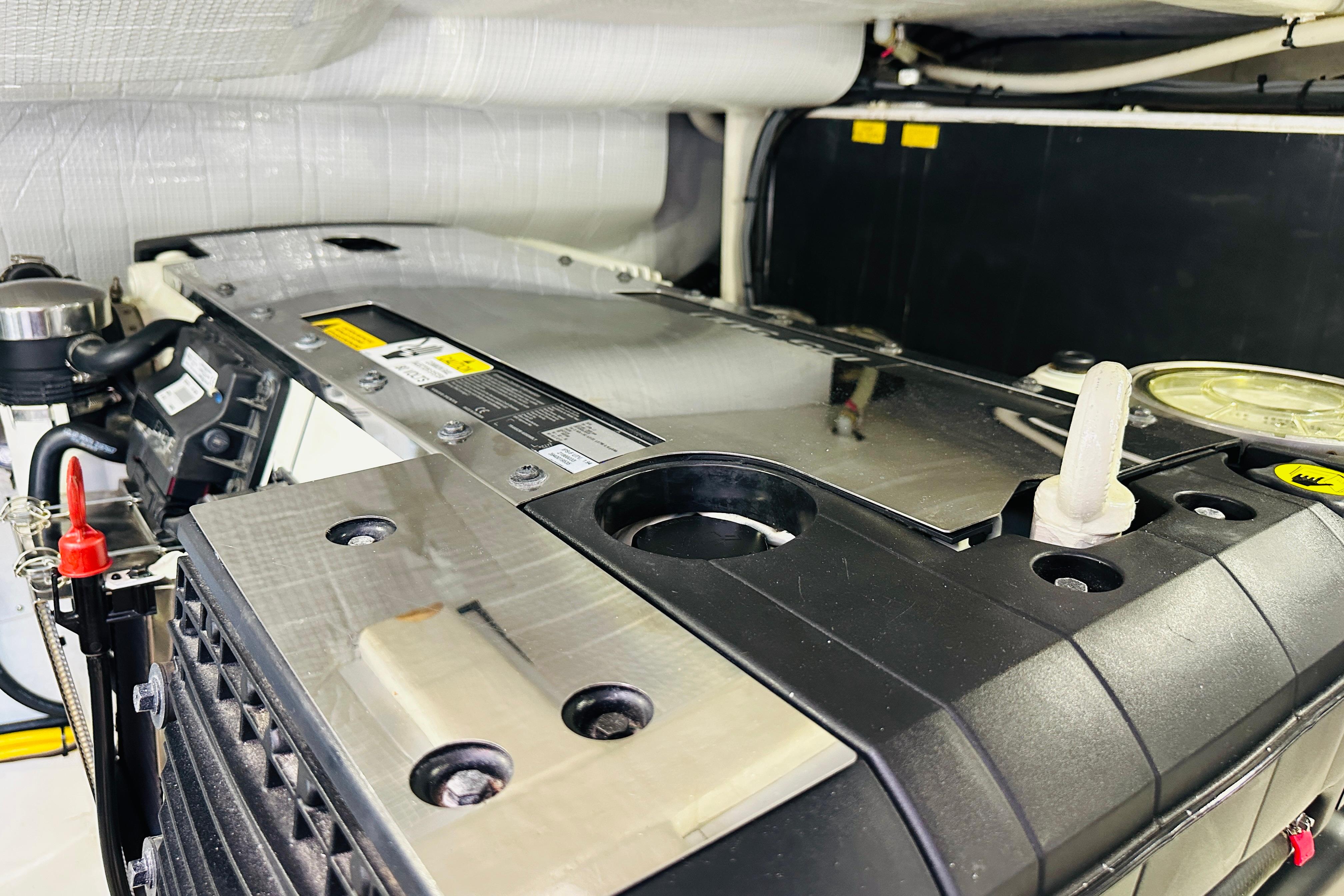 Engine compartment of a 2017 Sabre 42 Salon Express yacht, showcasing mechanical components.