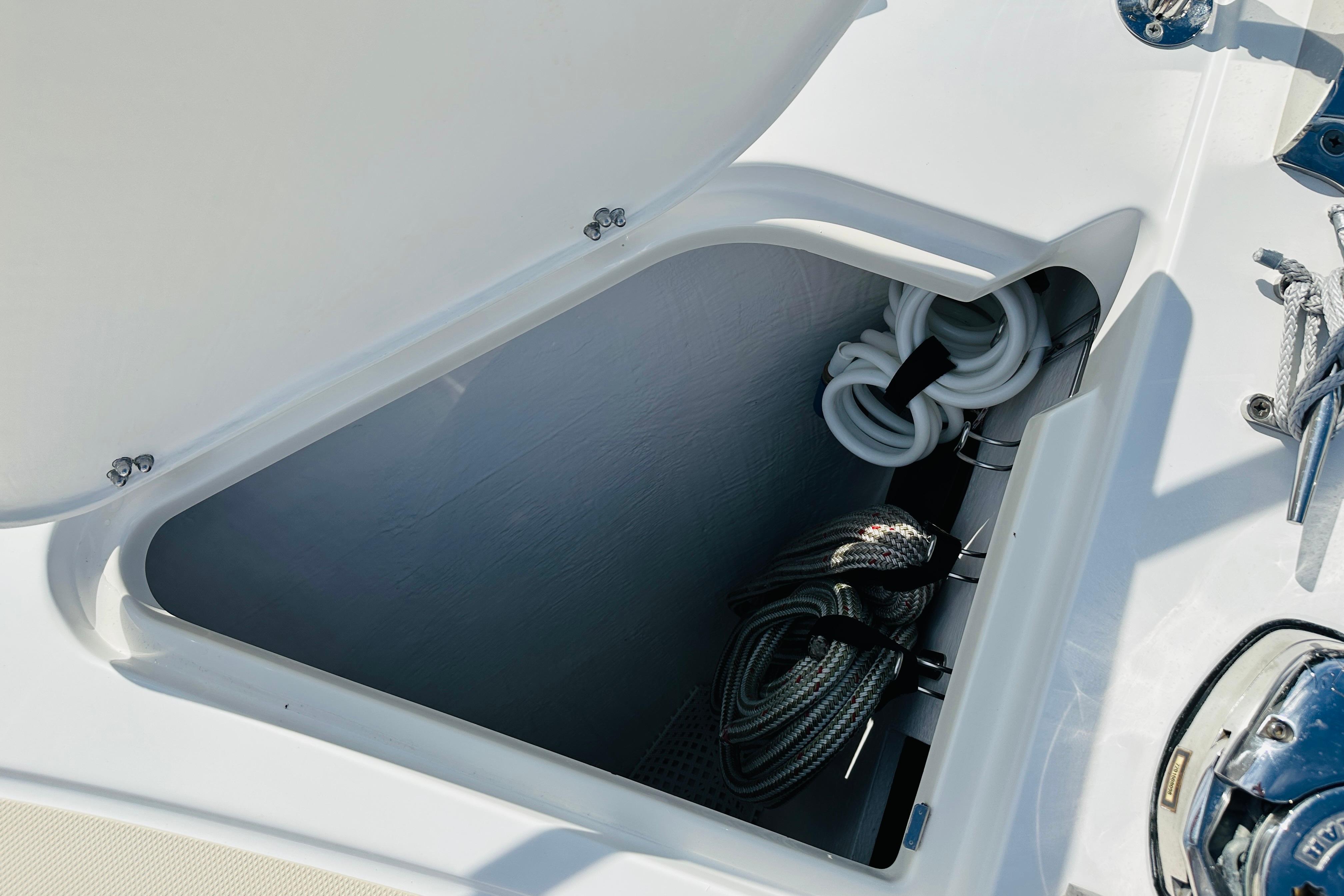 Storage compartment on 2017 Sabre 42 Salon Express yacht with coiled ropes.