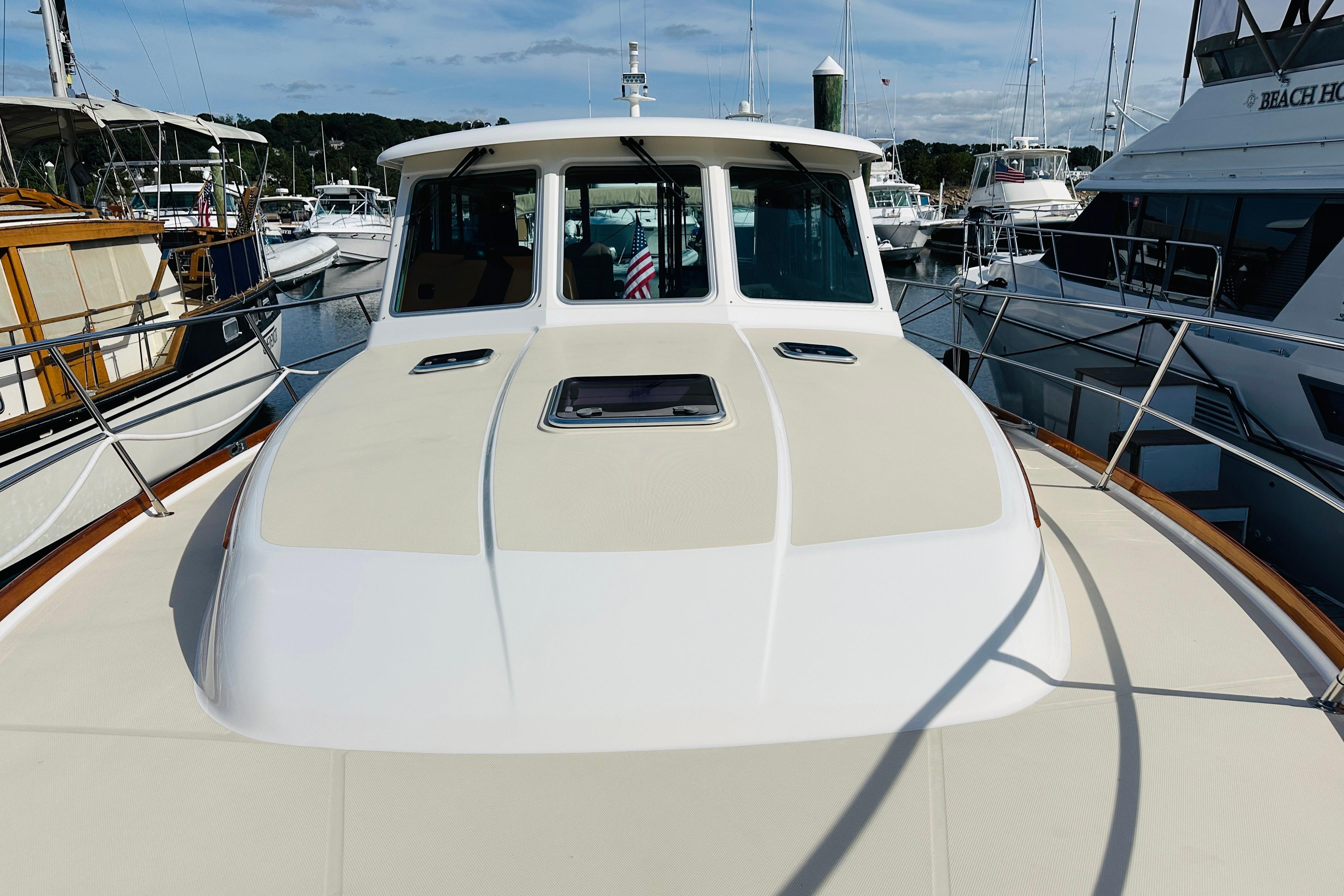 2017 Sabre 42 Salon Express yacht docked at marina, showcasing sleek design and spacious deck.