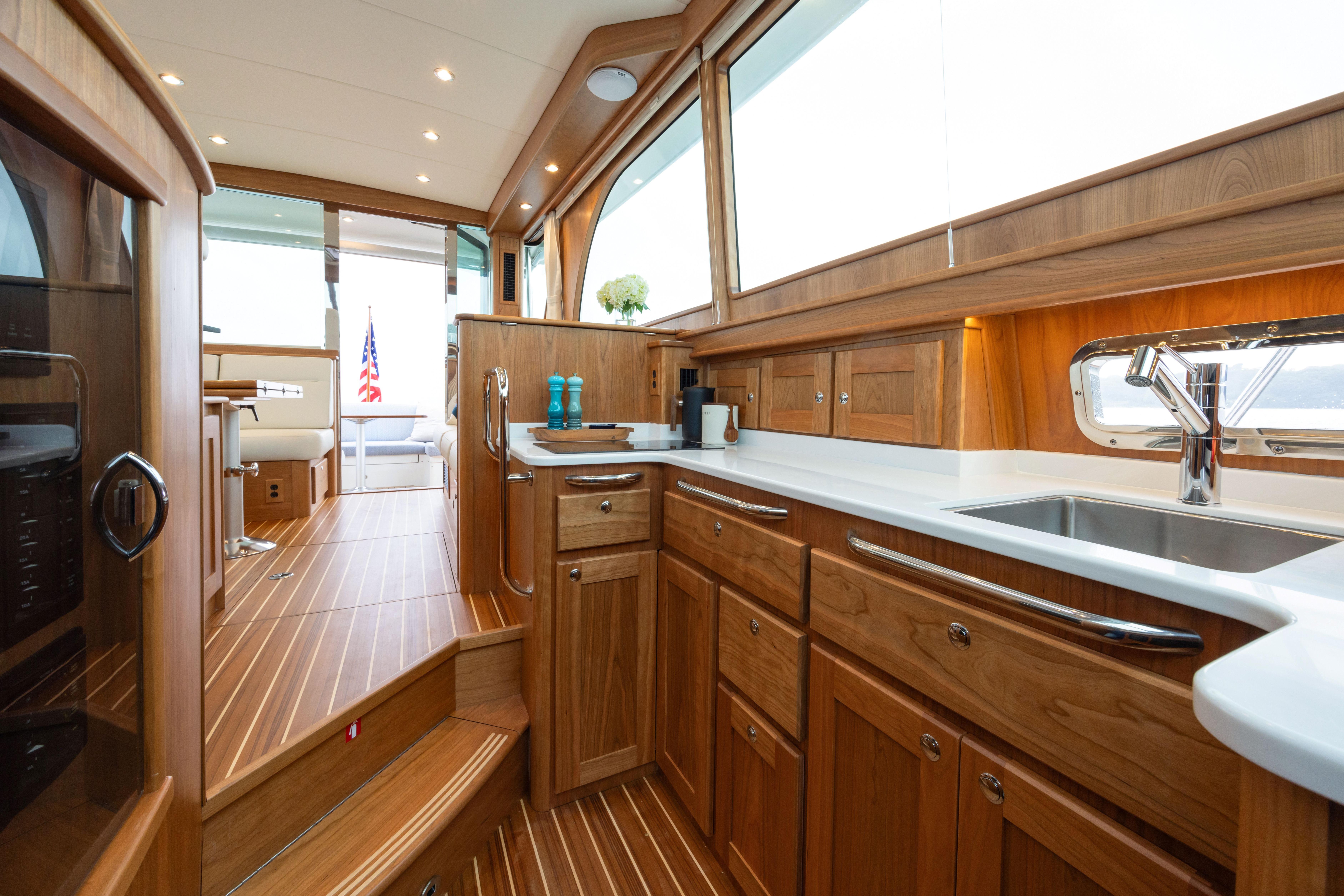 Luxurious interior of 2026 Sabre 45 Salon Express yacht with elegant wood finishes.