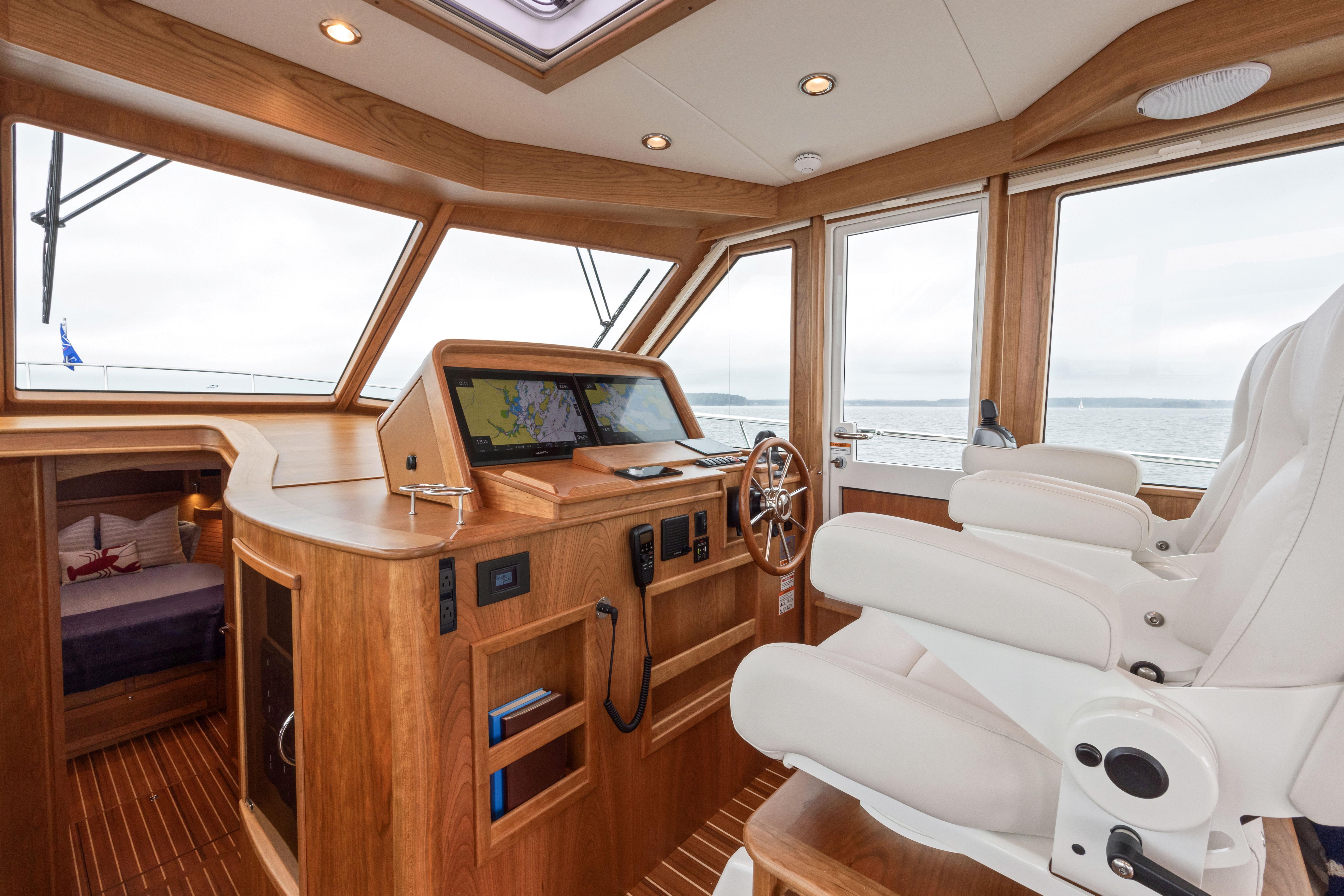 Interior of 2026 Sabre 45 Salon Express yacht with helm and navigation system.
