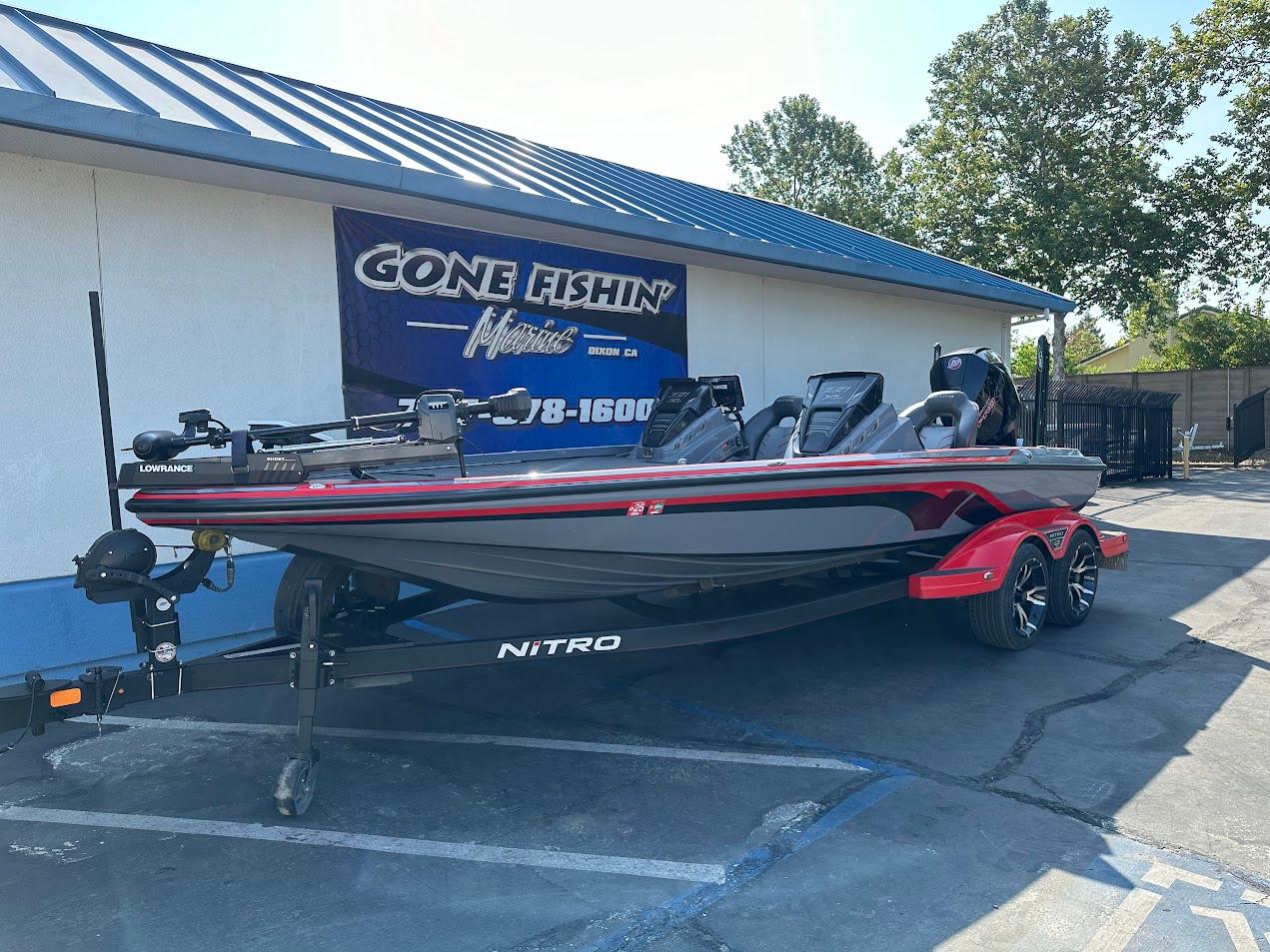 2023 Nitro Z21 XL Pro boat parked outside a fishing store.
