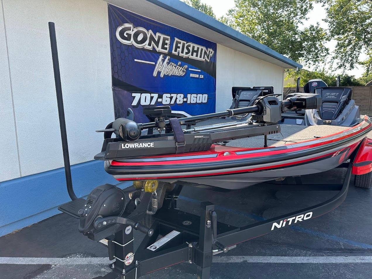 2023 Nitro Z21 XL Pro boat on trailer at dealership, featuring Lowrance equipment.
