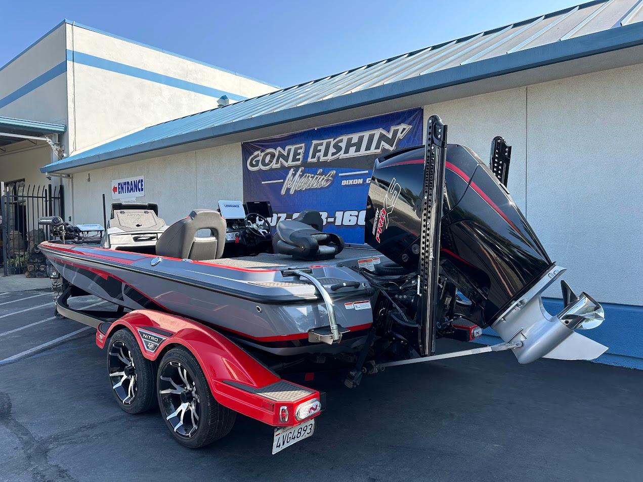 2023 Nitro Z21 XL Pro boat with powerful engine, parked outside a fishing store.