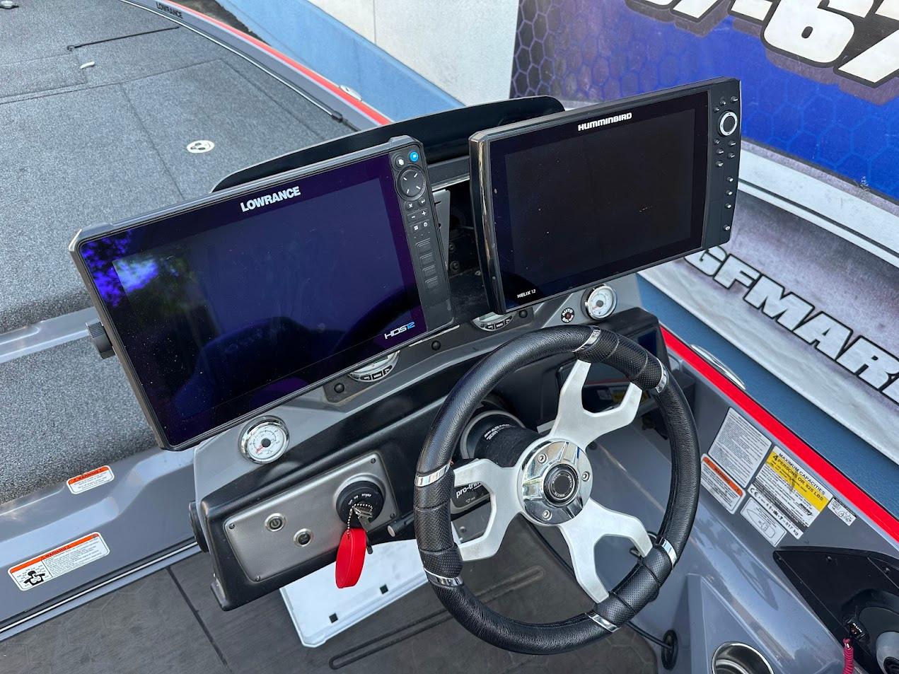 2023 Nitro Z21 XL Pro boat dashboard with dual Lowrance displays and steering wheel.