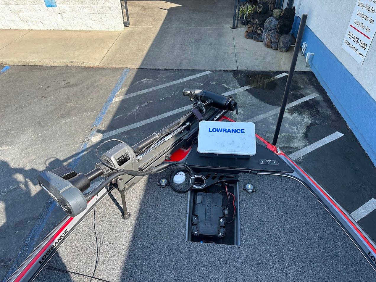 2023 Nitro Z21 XL Pro boat with Lowrance equipment on deck, parked in a lot.