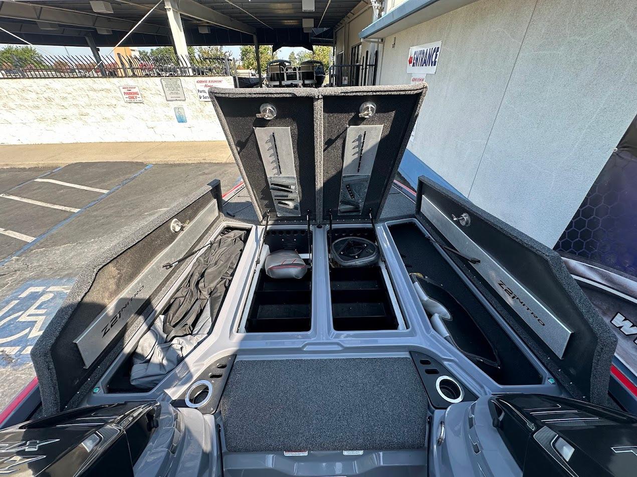 2023 Nitro Z21 XL Pro boat storage compartments open, showcasing spacious interior design.