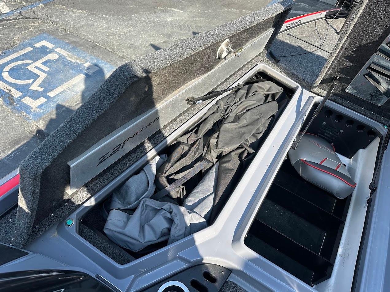 2023 Nitro Z21 XL Pro boat storage compartment with gear and accessories.