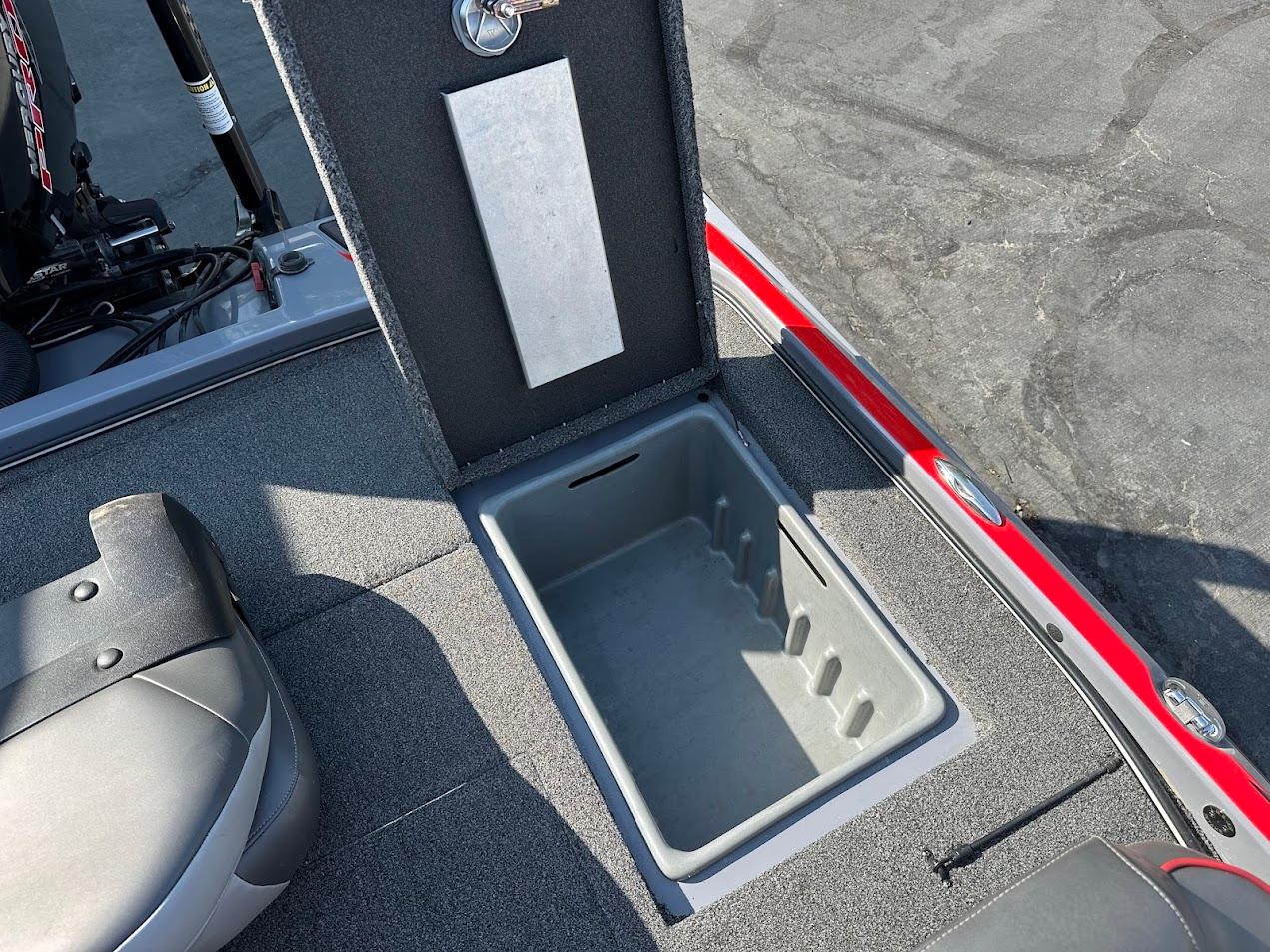 2023 Nitro Z21 XL Pro boat storage compartment with open lid, showcasing interior space.