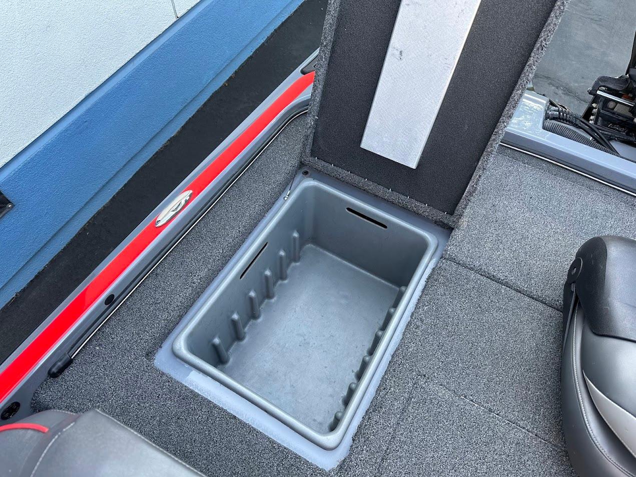 2023 Nitro Z21 XL Pro boat storage compartment with open lid.