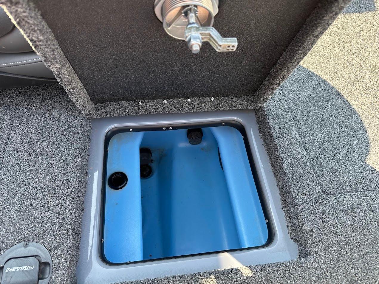2023 Nitro Z21 XL Pro boat storage compartment with blue interior.