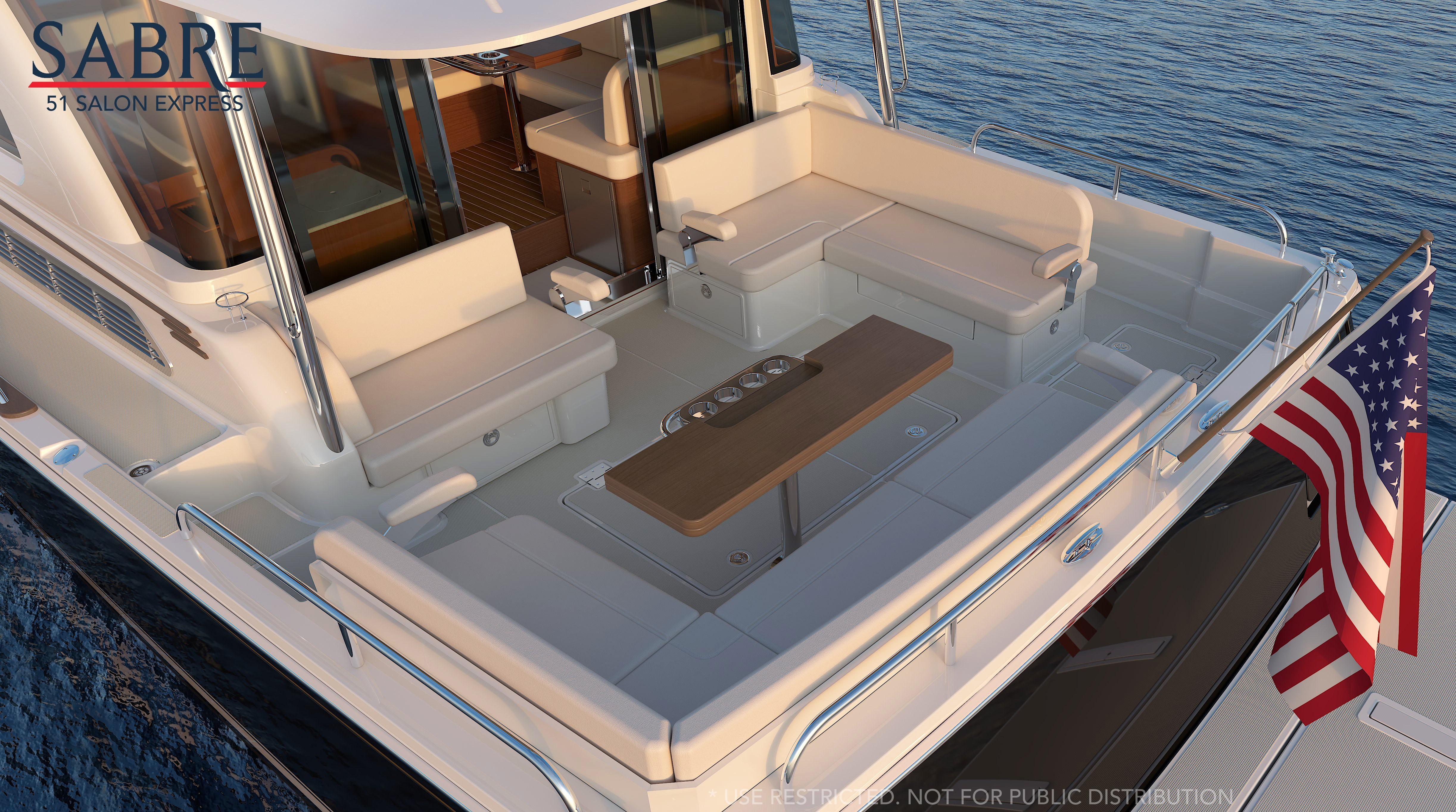 Luxurious 2026 Sabre 51 yacht with spacious outdoor seating and American flag.