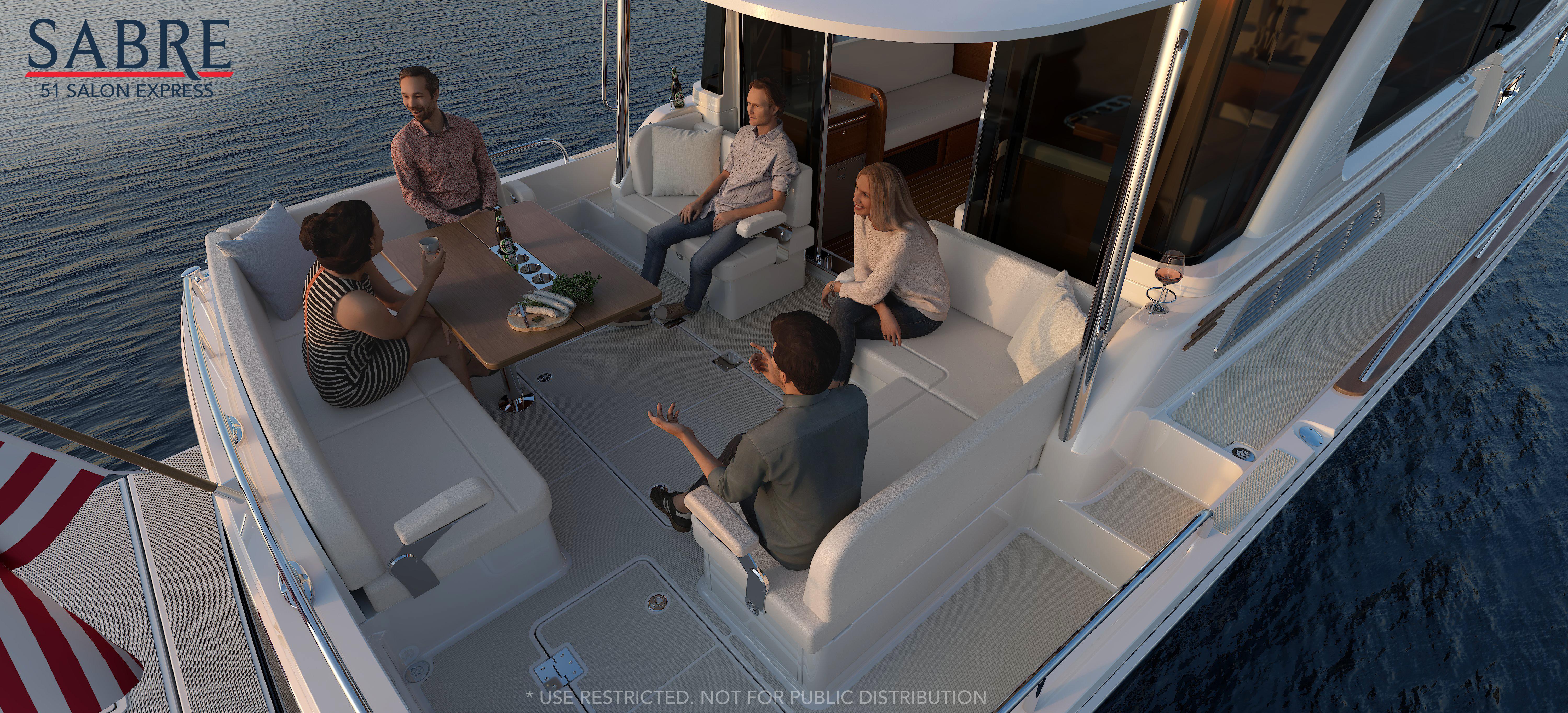 Five people relaxing on a 2026 Sabre 51 yachtu0027s deck at sunset.