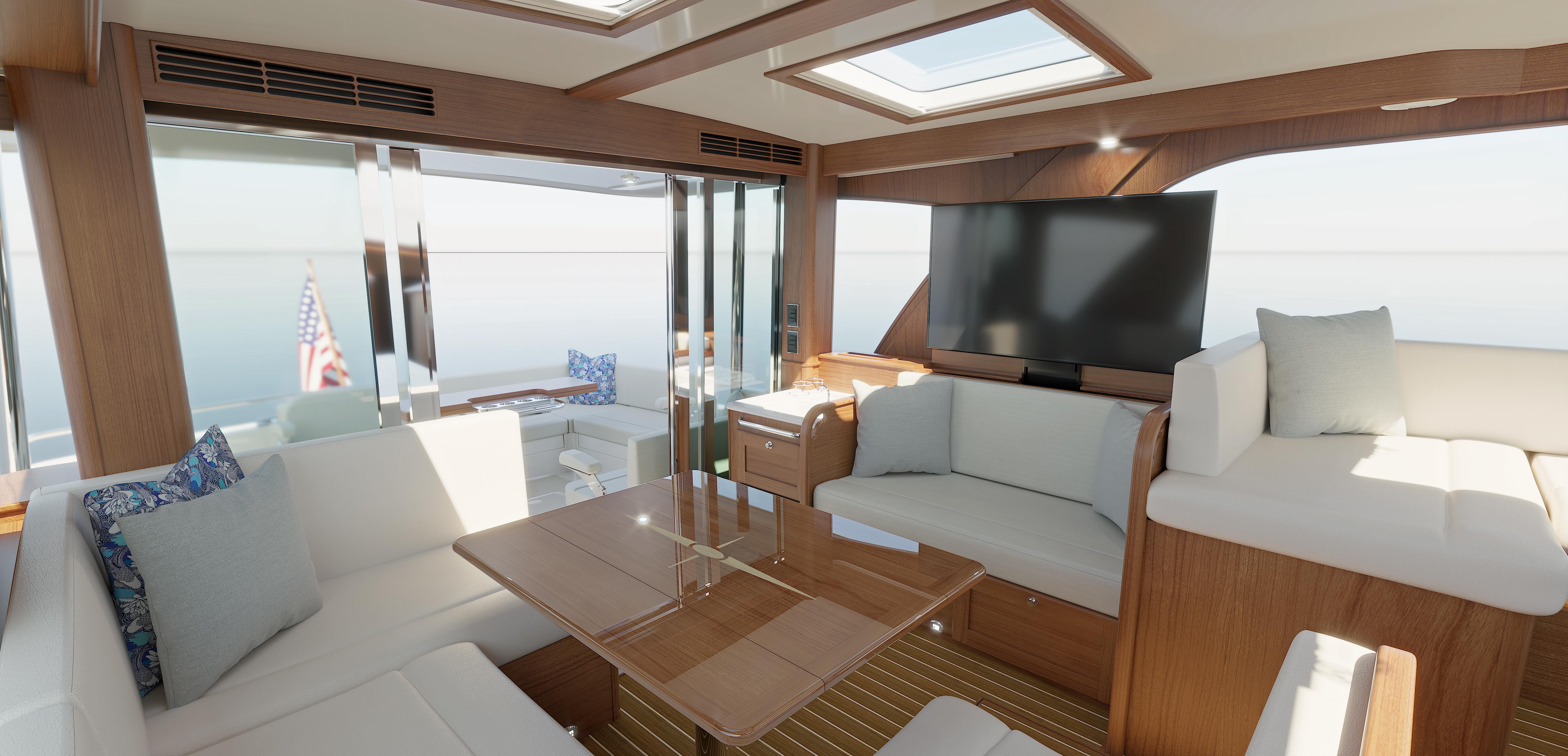 Luxurious interior of 2026 Sabre 51 yacht with modern seating and large TV.