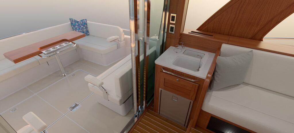 Luxurious interior of 2026 Sabre 51 yacht with seating and kitchenette.