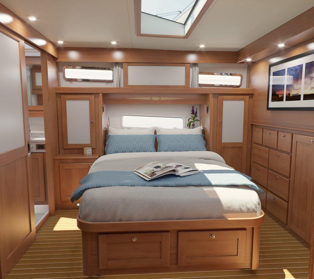 Luxurious 2026 Sabre 51 yacht bedroom with skylight, wooden cabinetry, and cozy bedding.