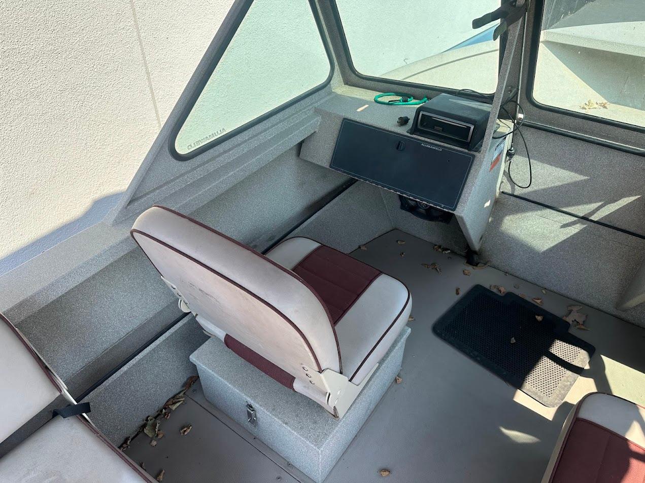 2003 Alumaweld Stryker boat interior with seating and control panel.