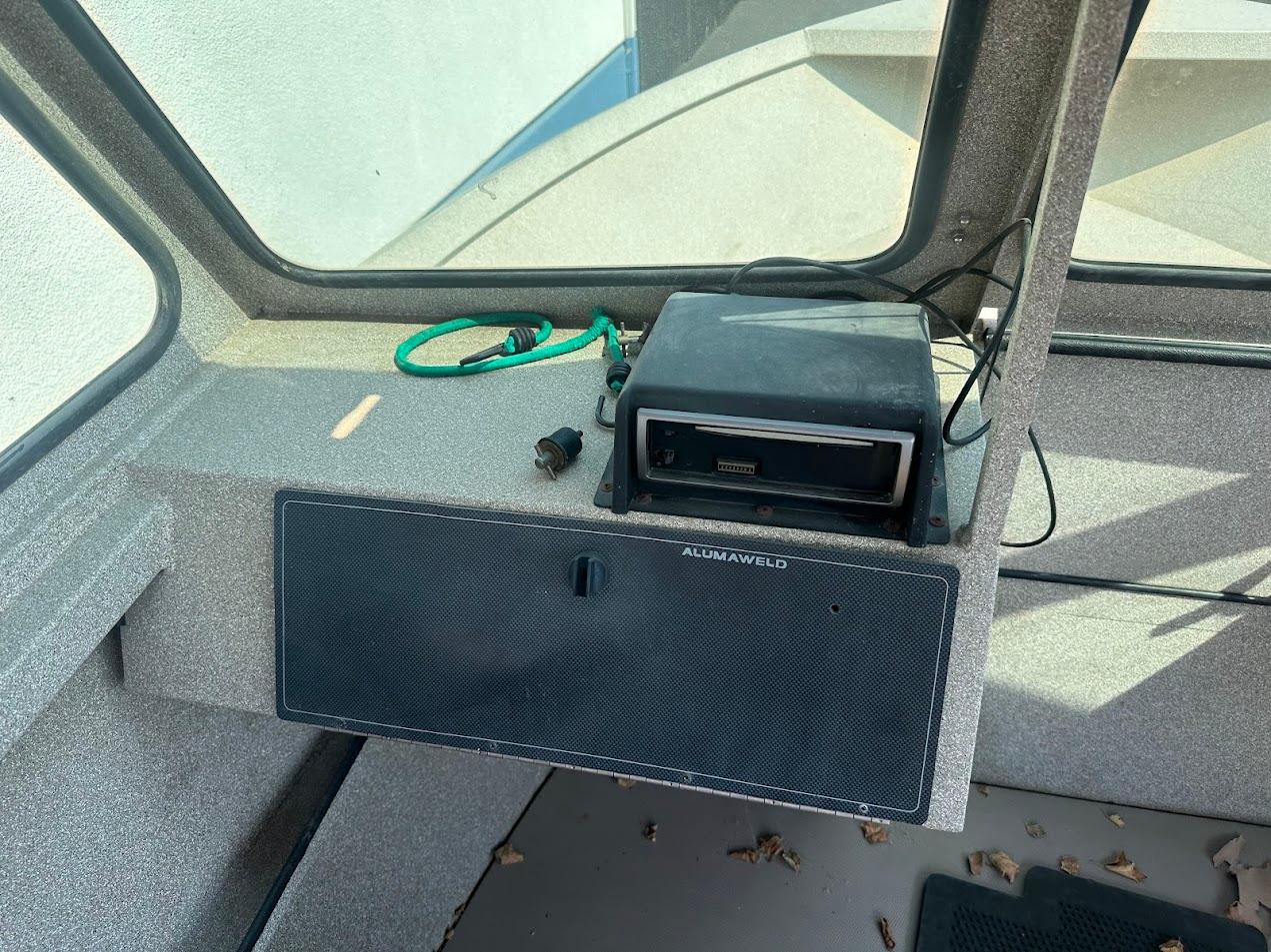 2003 Alumaweld Stryker boat interior with dashboard and electronic equipment.