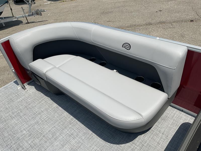 2026 Sun Tracker PB 16 DLX boat with sleek gray seating and cup holders.