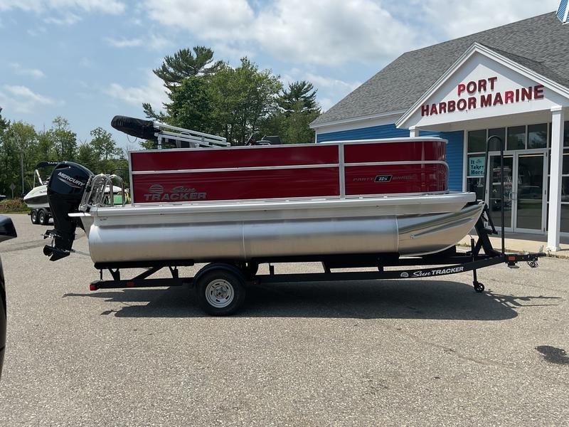 2026 Sun Tracker PB 16 DLX pontoon boat at Port Harbor Marine dealership.
