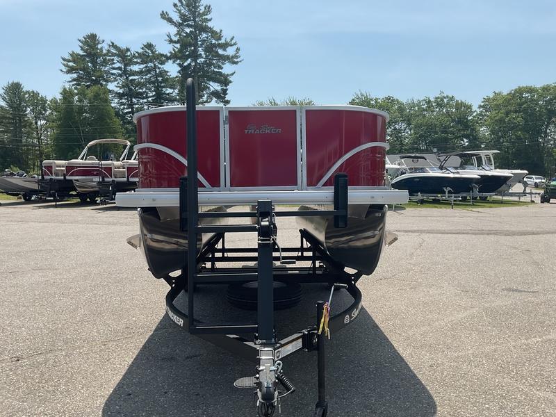 2026 Sun Tracker PB 16 DLX pontoon boat on trailer, parked outdoors.