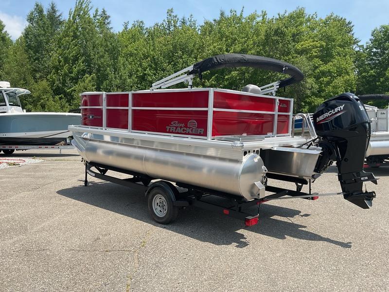 2026 Sun Tracker PB 16 DLX pontoon boat with Mercury outboard motor on trailer.